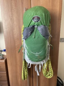 A rope packed into the Osprey Talon 33, under the brain and secured with the cinch straps.