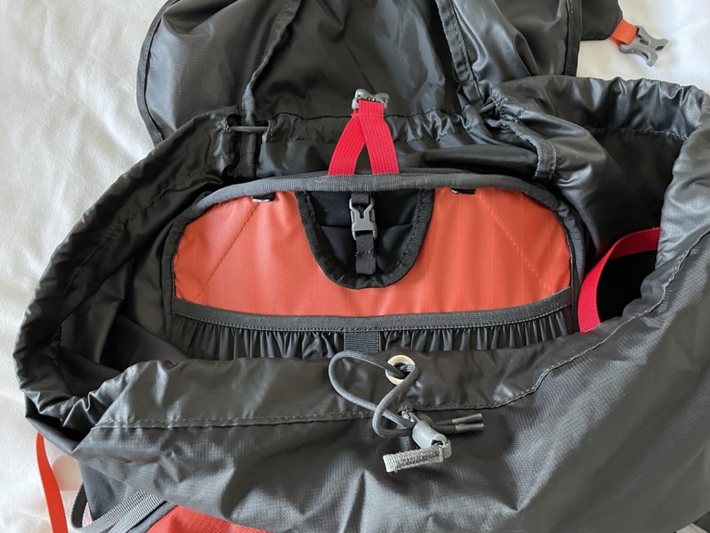 Osprey Exos 58 Blaze (black & orange) internal view, with pouch for a hydration bladder